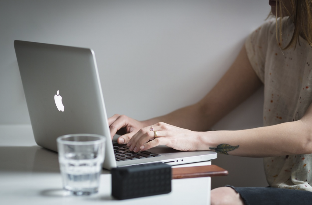 Close Up of Someone Typing on a Computer